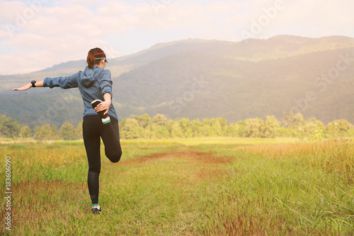 woman is running in the garden or outdoor, Warm up and exercise the body before sport activity, Healthy lifestyle of the people which popular sport is running, People running and jogging for health.