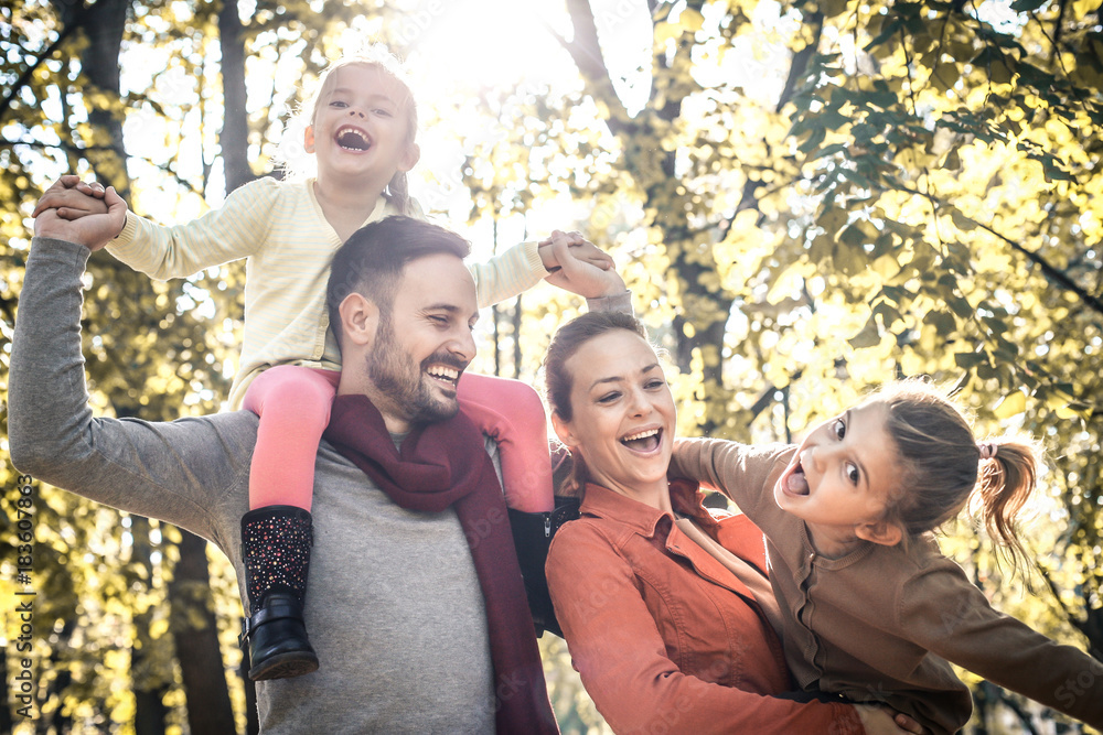 Happy family have fun in public park. Happy family have fun in public park.