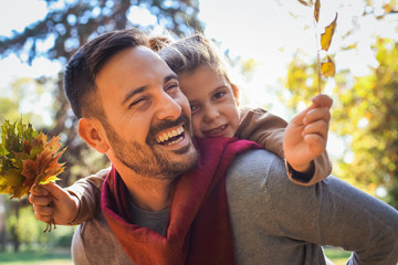 Father and daughter have fun together outside.