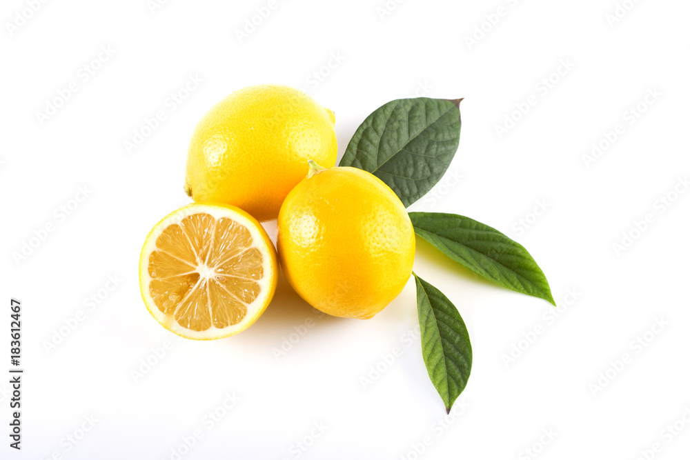 Lemons with leaves on a white background. Fresh lemons on a white background.