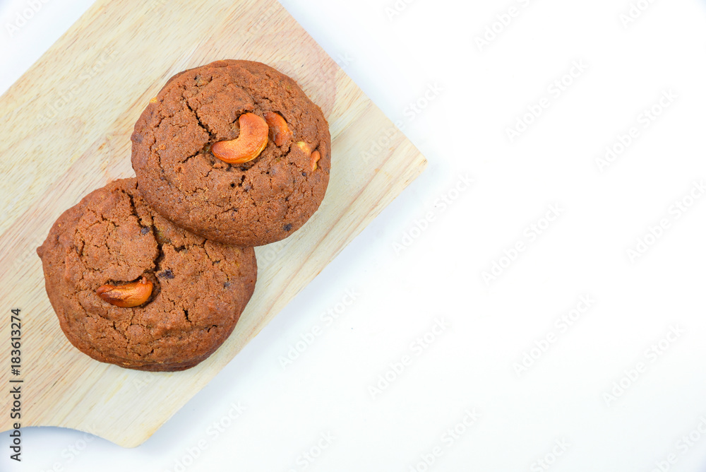 Fototapeta premium Cashews cookie on wooden boards and white background.