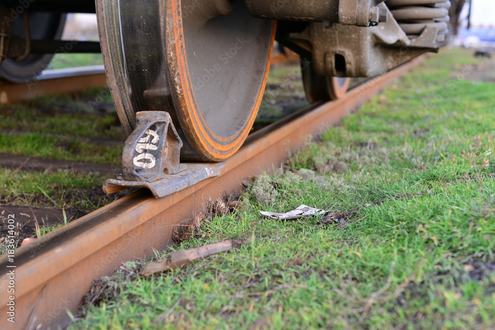Close-ups Steel diesel railcar train bogie wheels on the tracks.