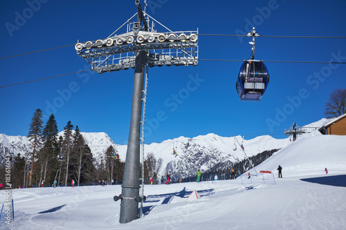 Skiers on the chairlift - ski resort during winter sunny day © ZoomTeam