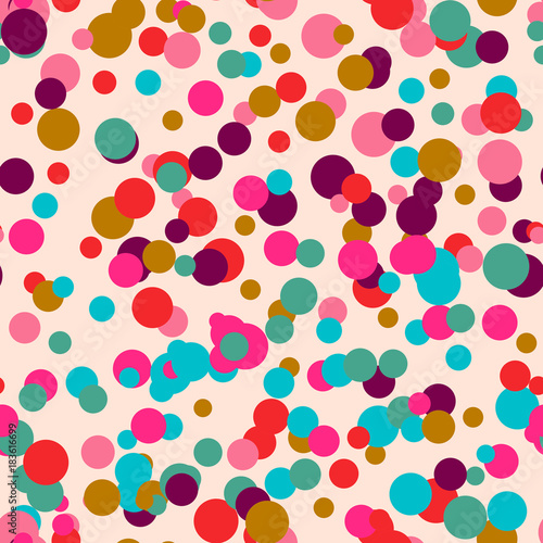Colorful messy dots on beige background. Festive seamless pattern with round shapes. Grunge dotted texture for wrapping paper, web. Vector illustration.