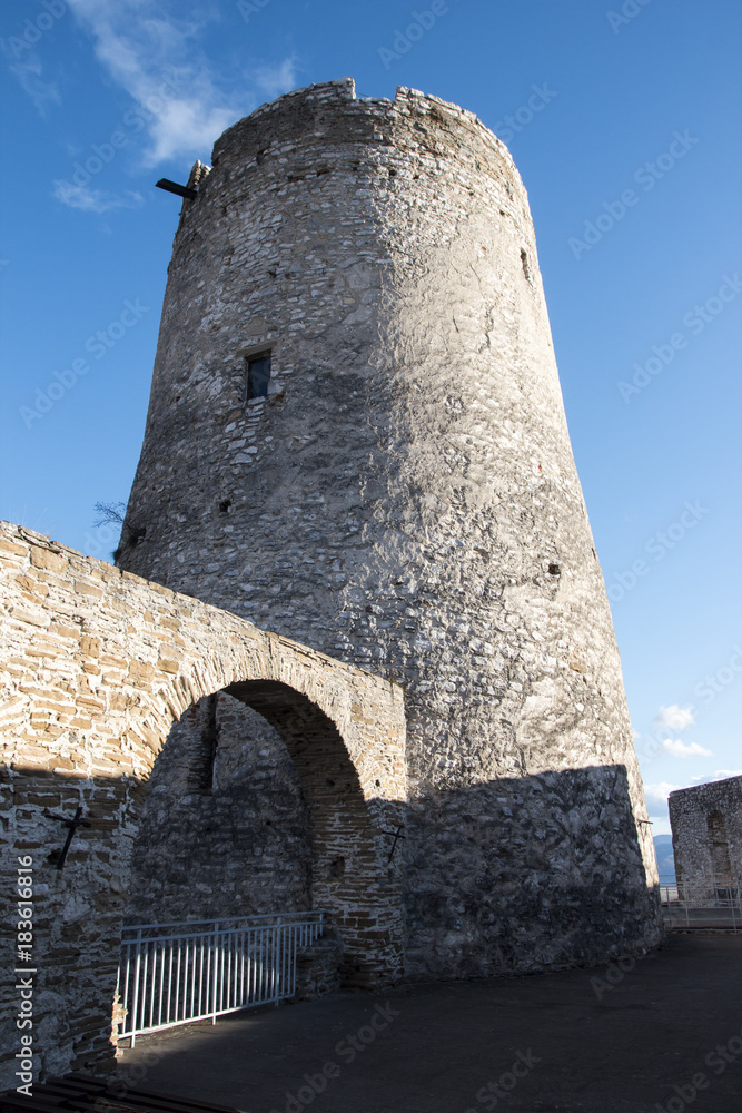 Round stone tower of the medieval castle Round stone tower of the medieval castle