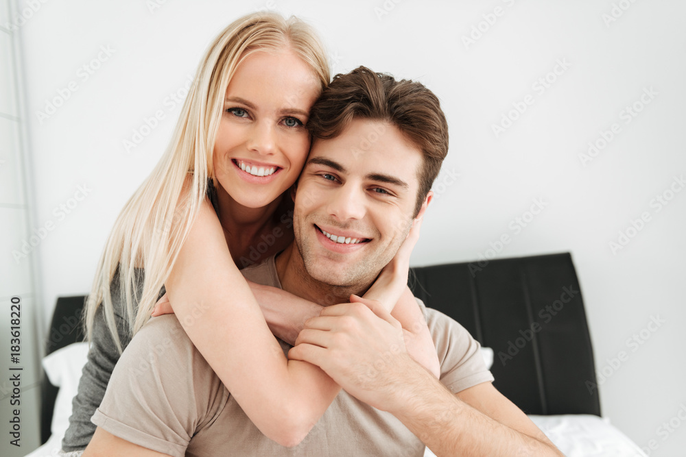 Portrait of beautiful couple looking camera in bed Portrait of beautiful couple looking camera in bed
