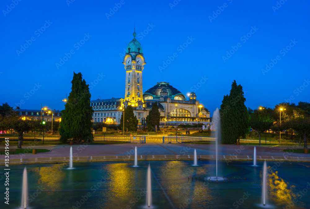 Naklejka premium Limoges-Bénédictins night view with water pool fountain, main railway station of Limoges, in Orléans–Montauban. Named due to the presence of a Benedictine monastery closed during the France revolution