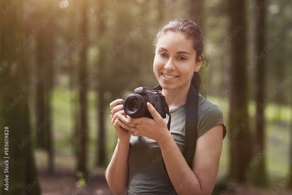 Photographer taking pictures in the forest Photographer taking pictures in the forest