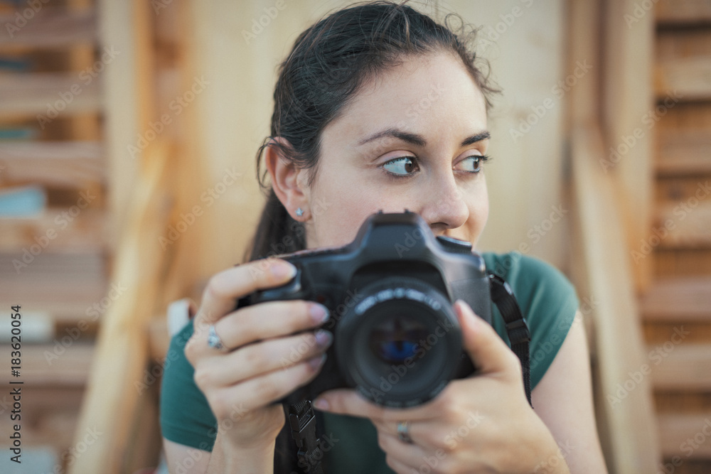 Woman posing with a digital camera