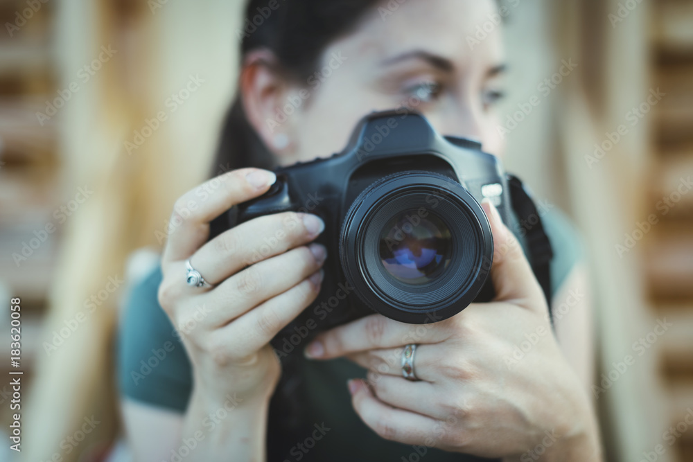 Woman posing with a digital camera Woman posing with a digital camera