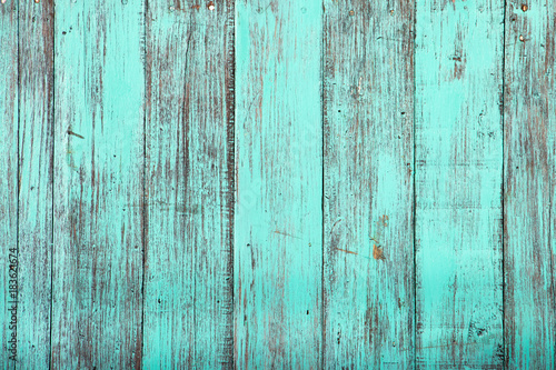 Blue color, grunge old scratched wood board textured background © bankrx
