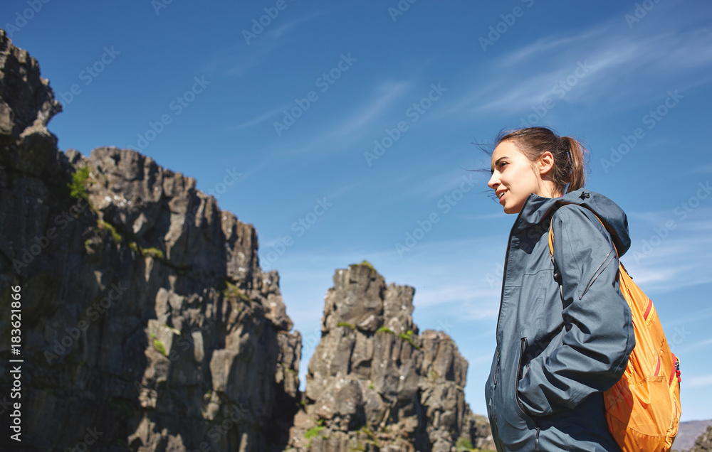 Fototapeta premium young woman hiker hiking in beautiful mountains