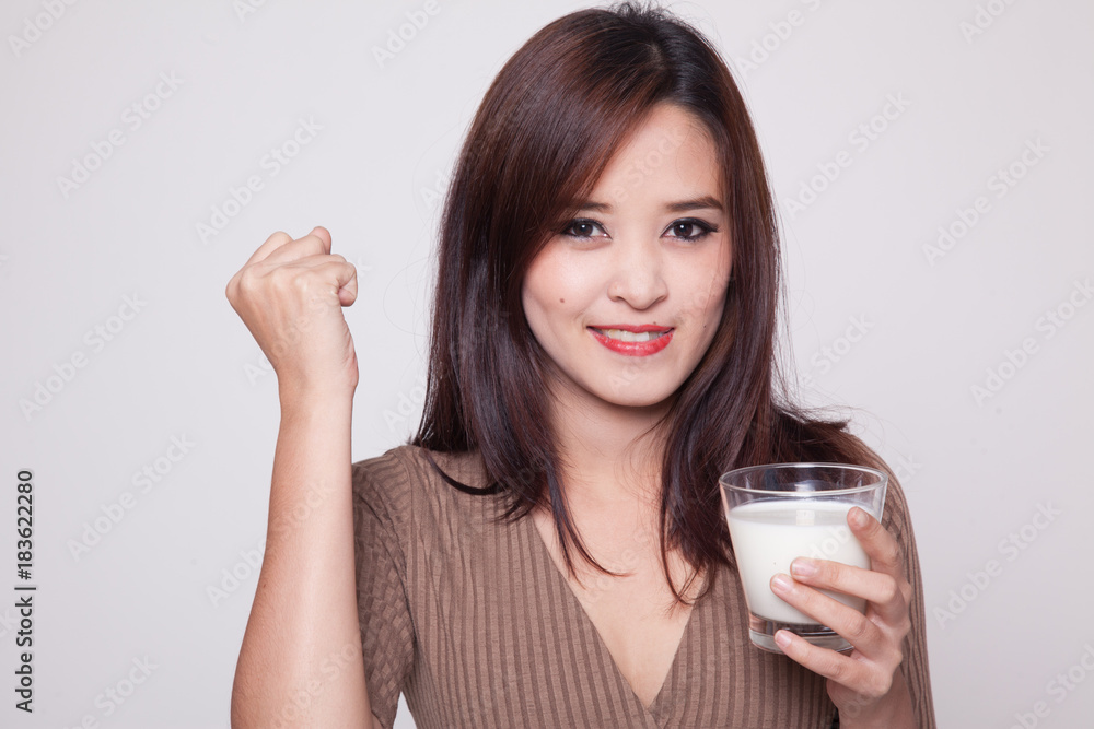 Healthy Asian woman drinking a glass of milk. Healthy Asian woman drinking a glass of milk.