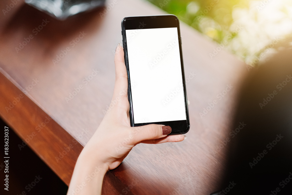 Close up of woman using mobile smart phone,sending massages on the garden.having sunbath.Phone with black screen,texting,video calls, Close up of woman using mobile smart phone,sending massages on the garden.having sunbath.Phone with black screen,texting,video calls,