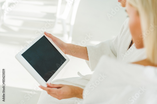 cropped shot of young women using digital tablet at spa center © LIGHTFIELD STUDIOS