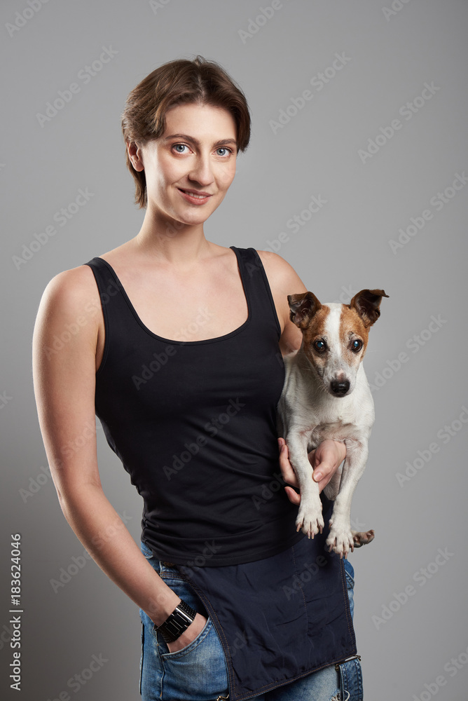 Smiling brunette girl with dog