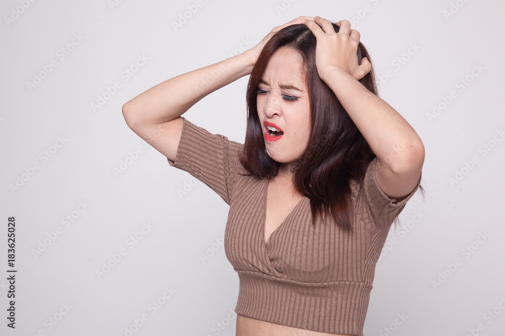 Stressed young Asian businesswoman scream out. Stressed young Asian businesswoman scream out.
