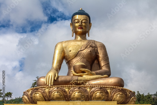 Close up view of giant Buddha Dordenma statue with the blue sky and clouds background  Thimphu  Bhutan