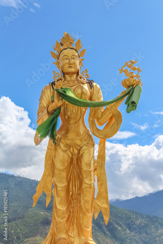 Golden statue of Buddhist Goddess at top hill in Kuensel Phodrang Nature Park, Thimphu, Bhutan photo