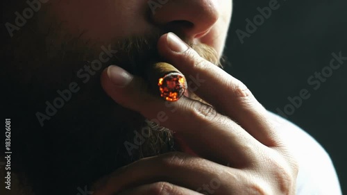 Man smoking cigar photo