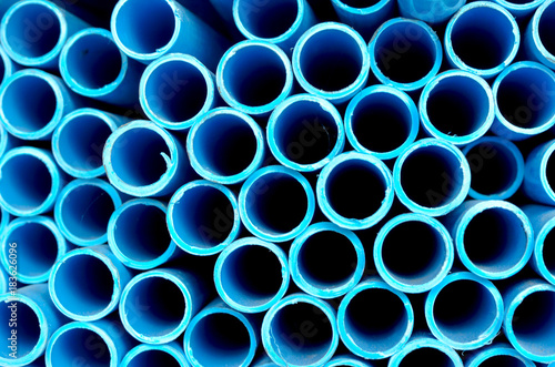 blue PVC tubes in storage  Plastic tubes  Background of PVC Water pipes wallpaper background.