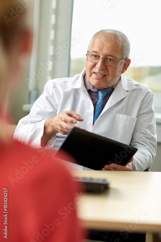 senior doctor and patient at womens health clinic