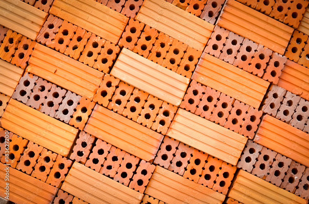 Orange brick used in construction architecture, background texture