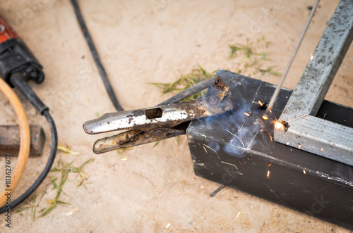 Close-up of welder working in workshop.