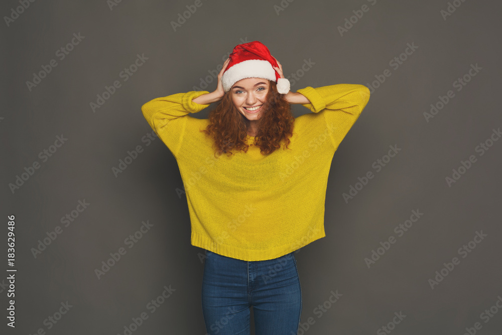 Young laughing attractive woman in santa hat Young laughing attractive woman in santa hat