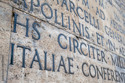 Ancient Latin inscription on the outside wall of Ara Pacis wall in Rome photo