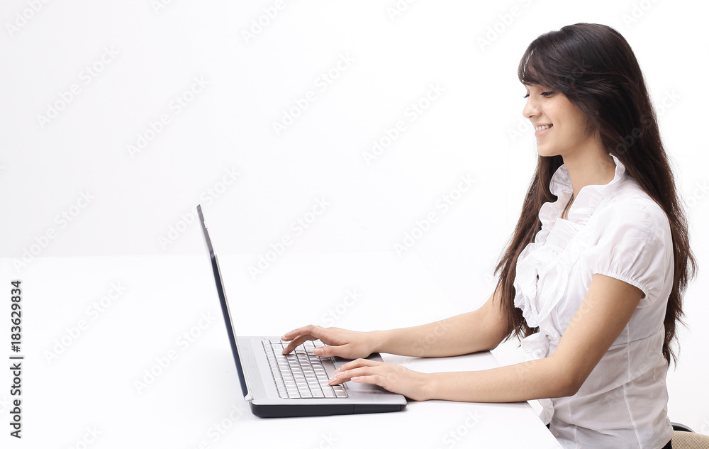 young woman typing text on laptop keyboard