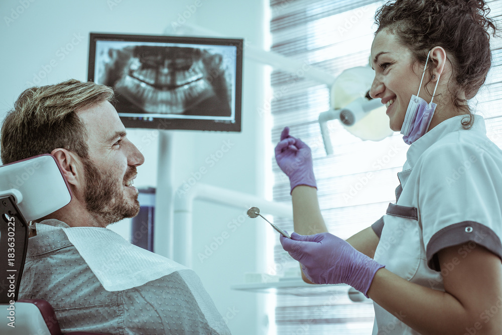 Fototapeta premium Young Man at dentists office. Close up.