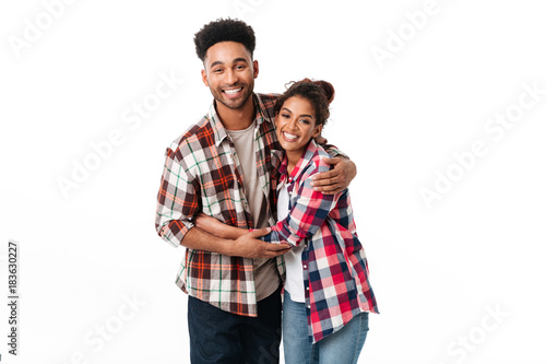 Wallpaper Mural Portrait of a happy young african couple hugging Torontodigital.ca