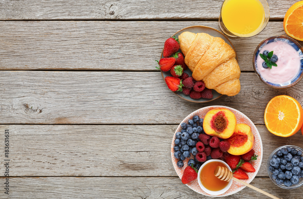 Fresh crusty croissants and orange juice for morning meals Fresh crusty croissants and orange juice for morning meals