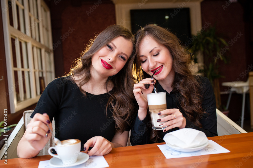 Two beautiful girls drinking coffee Two beautiful girls drinking coffee