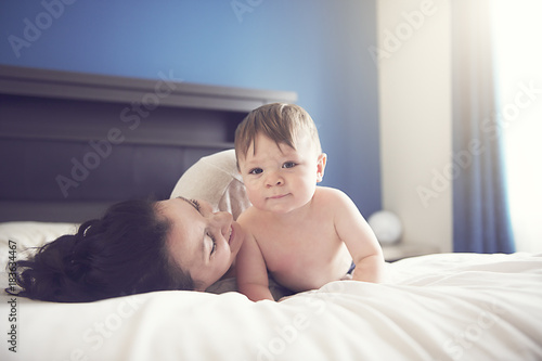 Mother and her son child taking good time on bed