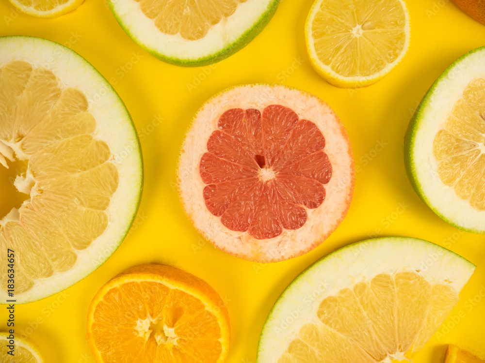 Colorful set of cut slices of citrus fruits of orange, lime, grapefruit, tangerine, lemon and pomelo. Mixed fresh health fruit. Background with citrus-fruit of lemon, orange and grapefruit slices. Colorful set of cut slices of citrus fruits of orange, lime, grapefruit, tangerine, lemon and pomelo. Mixed fresh health fruit. Background with citrus-fruit of lemon, orange and grapefruit slices.