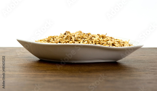 Macro closeup Side view of astragalus root in plate