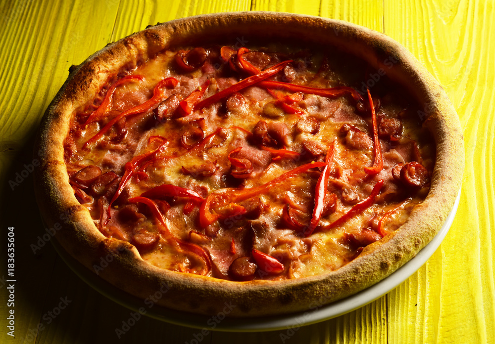 Restaurant menu and italian cuisine concept. American spicy pizza Restaurant menu and italian cuisine concept. American spicy pizza