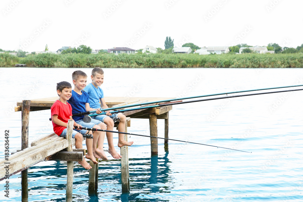 Fototapeta premium Cute children fishing on summer day