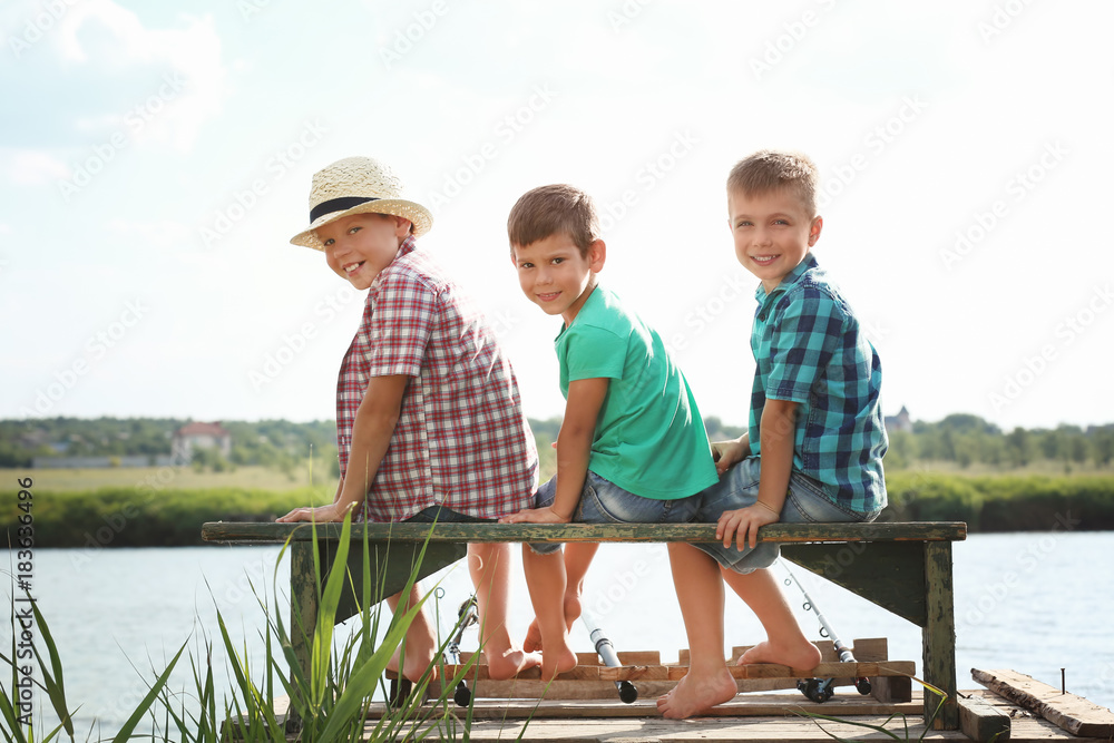 Cute children fishing on summer day Cute children fishing on summer day