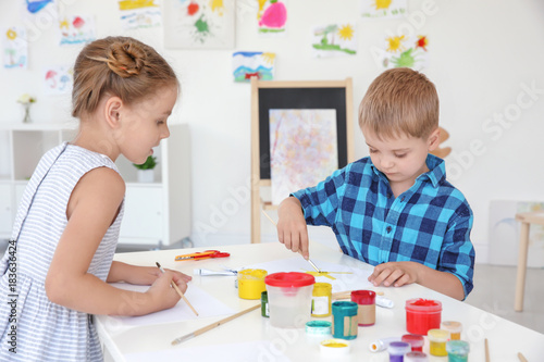 Children at painting lesson in classroom