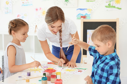 Children with teacher at pa...