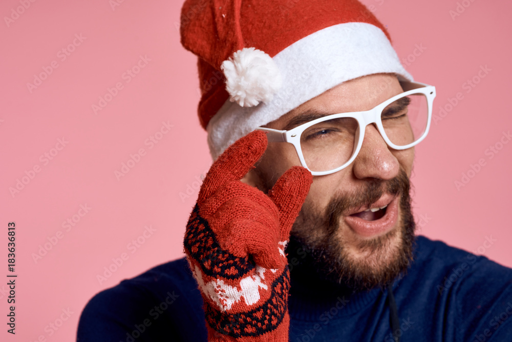 portrait of a man in glasses showing the size of his fingers, new year portrait of a man in glasses showing the size of his fingers, new year