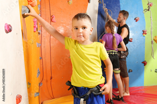 Adorable little boy in climbing gym