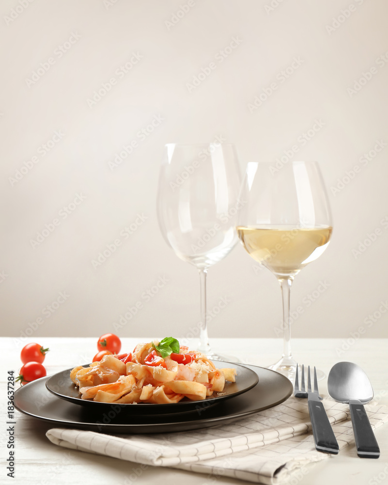Plate of tasty pasta with shrimps on table Plate of tasty pasta with shrimps on table
