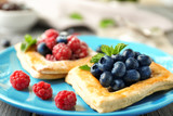 Yummy puff pastry with berries on plate