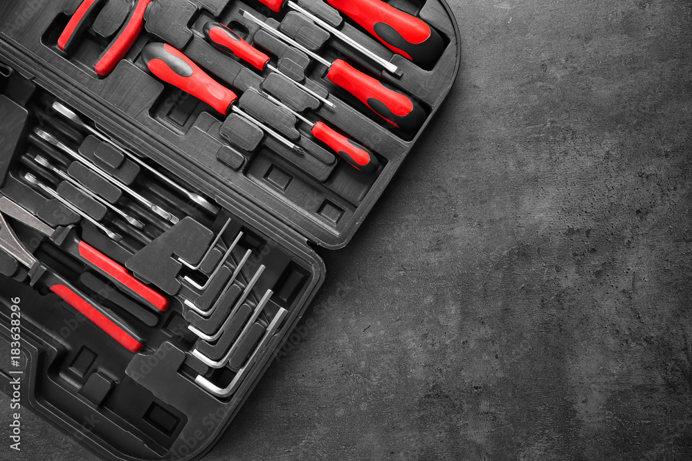 Fototapeta premium Set of tools in box on gray background