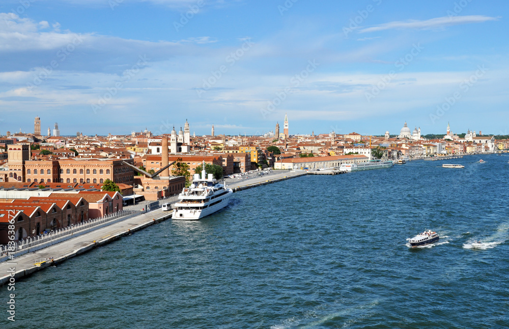 panoramic view of Venice from the height of the cruise ship to Piazza San Marco and the Ducale, or Doge's Palace. on the Grand canal many boats, river transport, in the background of ancient architect panoramic view of Venice from the height of the cruise ship to Piazza San Marco and the Ducale, or Doge's Palace. on the Grand canal many boats, river transport, in the background of ancient architect