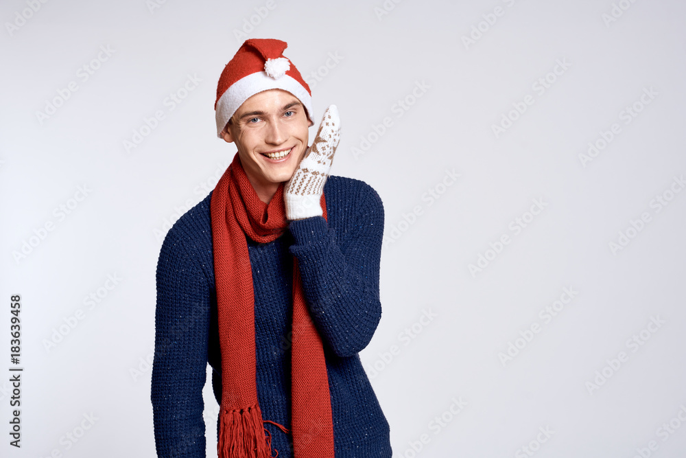 man in christmas clothes on a light background, free space for copying, holiday man in christmas clothes on a light background, free space for copying, holiday